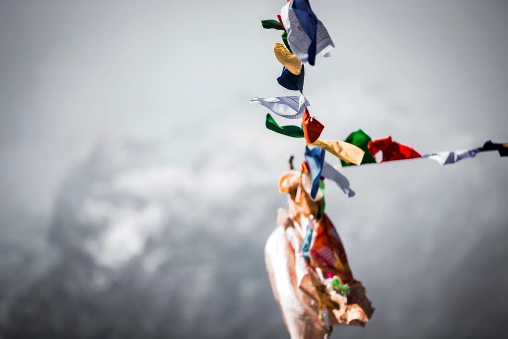 Prayer flags strung across a Himalayan ridge